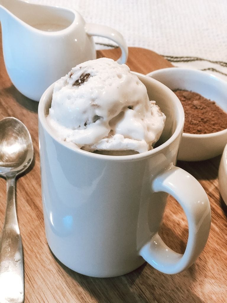 Close up of guilt-free chocolate mug cake topped with ice-cream 