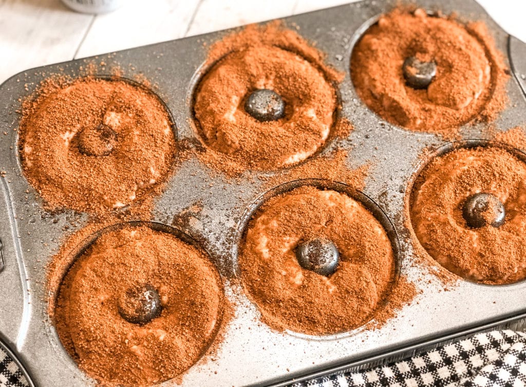 Close up of cinnamon sugar bagels in bagel pan.