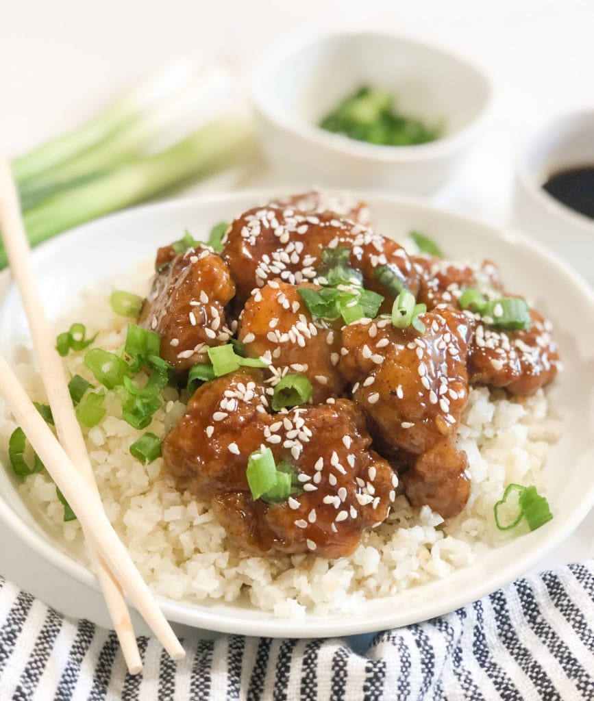 Close up of  Asian Sesame Honey Chicken on white plate