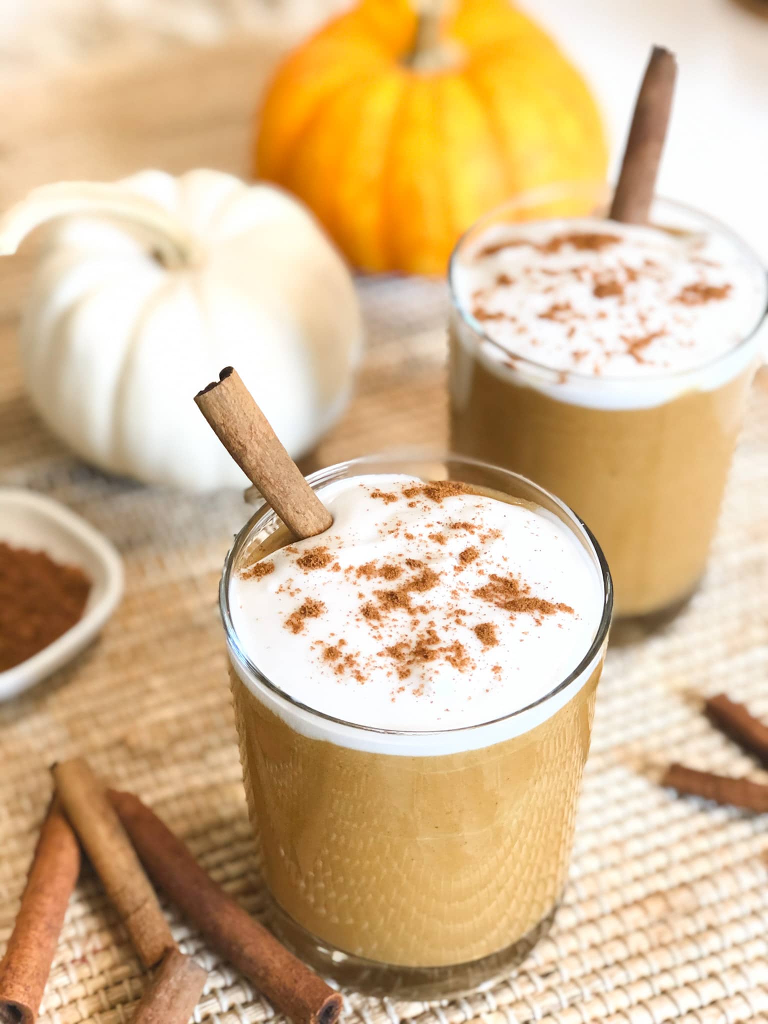 Close up of pumpkin smoothie with dairy free cream topping