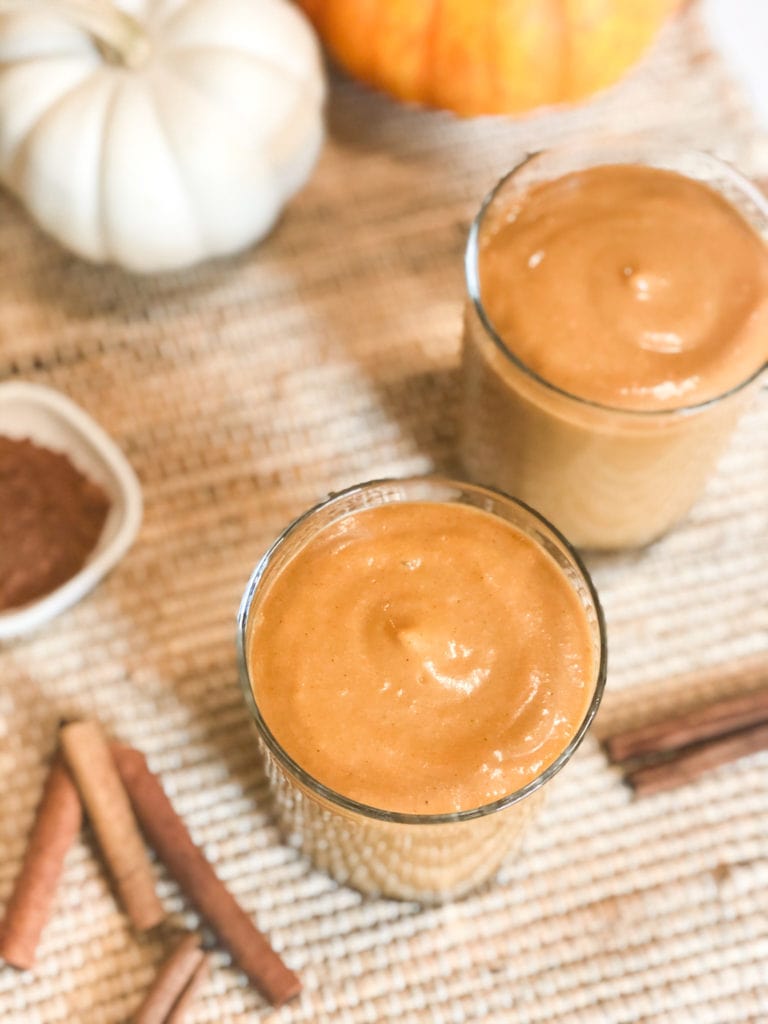 Close up of pumpkin pie smoothie in a glass.