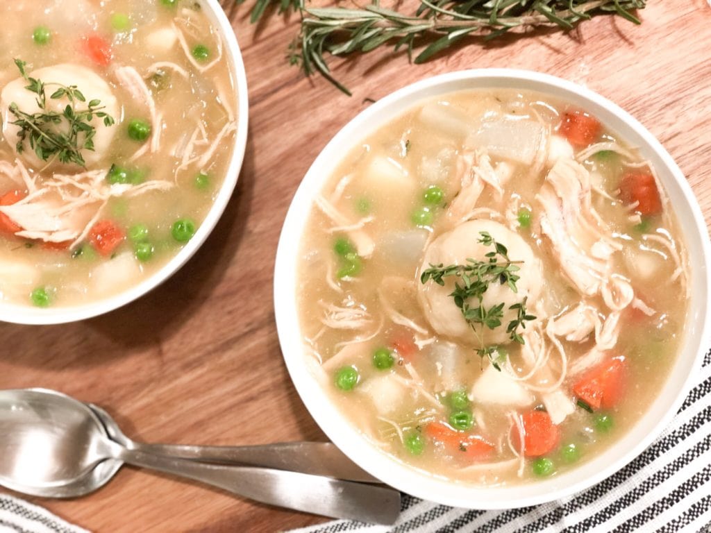 Close up of chicken pot pie soup in white bowl