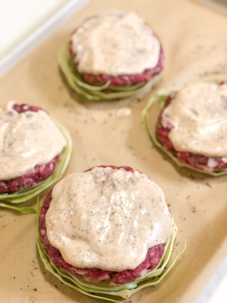 Close up of Paleo Beef Burgers -N- Cabbage on a sheet pan