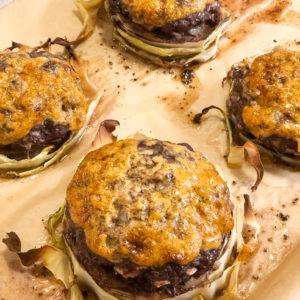 Close up of Paleo Beef Burgers -N- Cabbage on a sheet pan