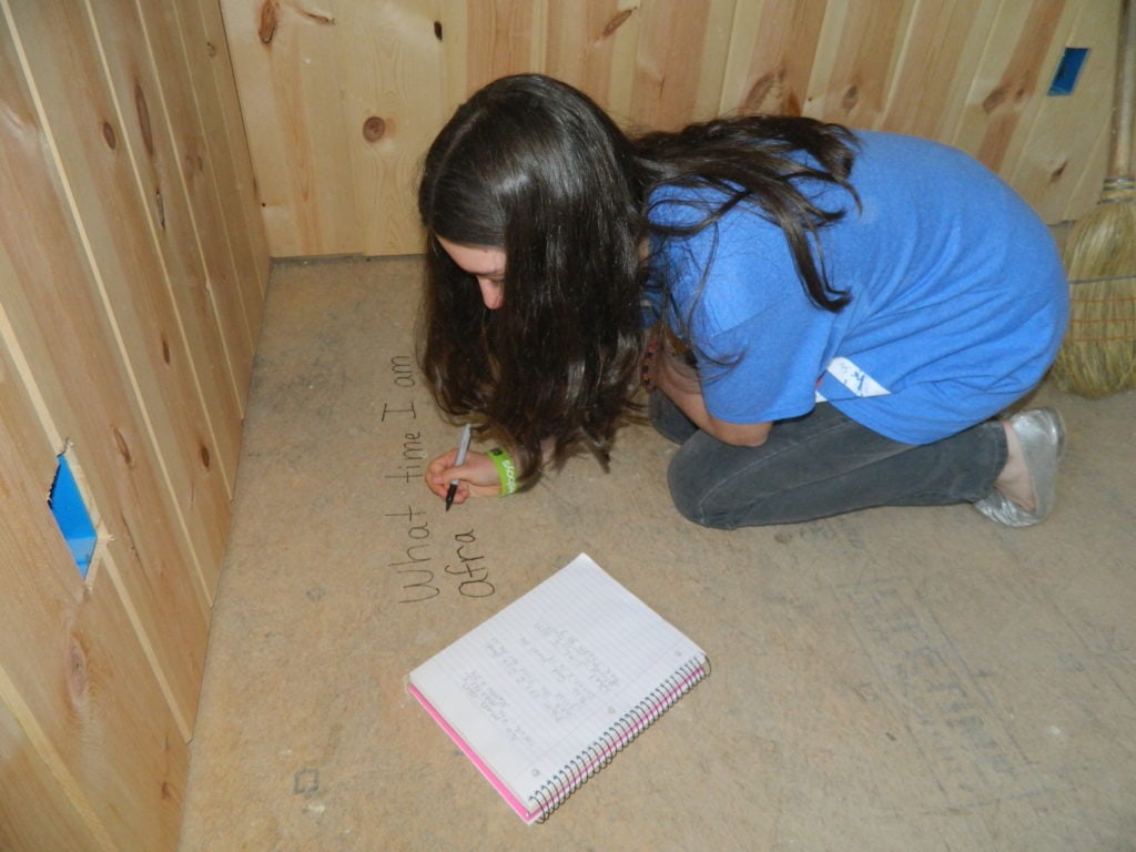 Our youngest writing scripture and statements to Jesus in her bedroom.