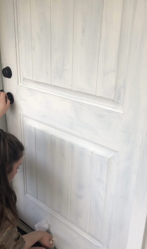 My daughter cleaning and prepping our front door